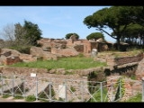 02979 ostia - regio ii - insula ix - tempietto repubblicano (ii,ix,4) - decumanus maximus ecke via dei molini - blick nach nordwesten.jpg